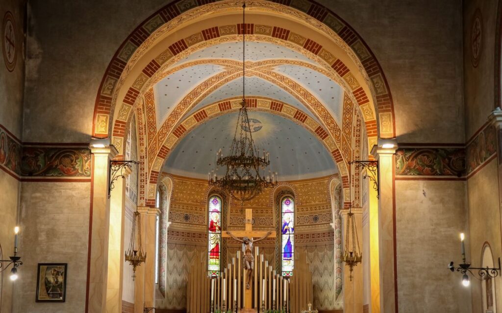 Stunning interior of traditional church in Spresiano, Italy with altar and frescoes.