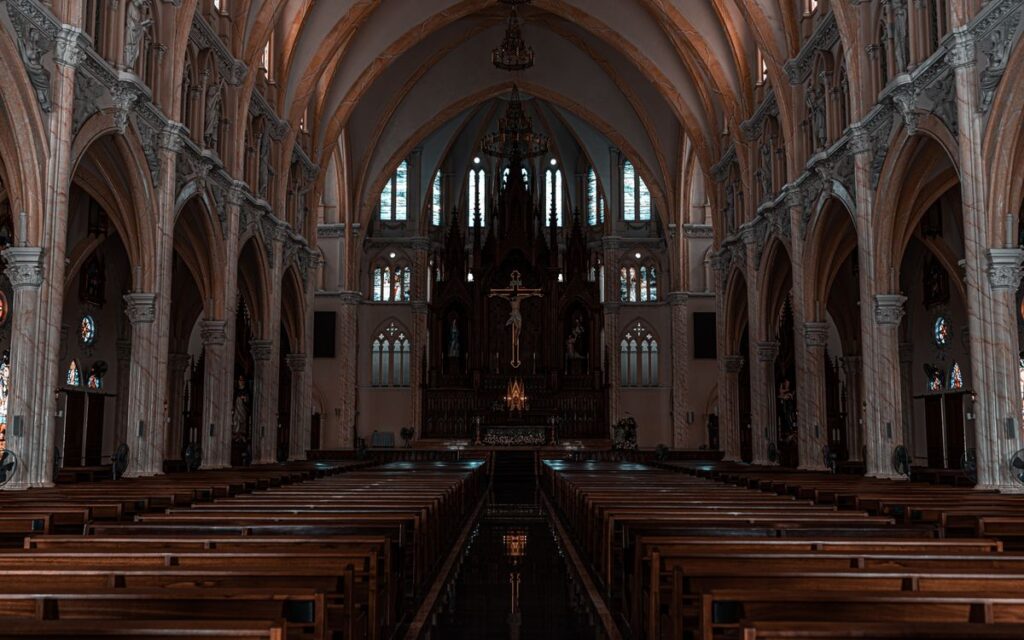 Beautiful view of a Gothic cathedral's interior with detailed arches and altar.