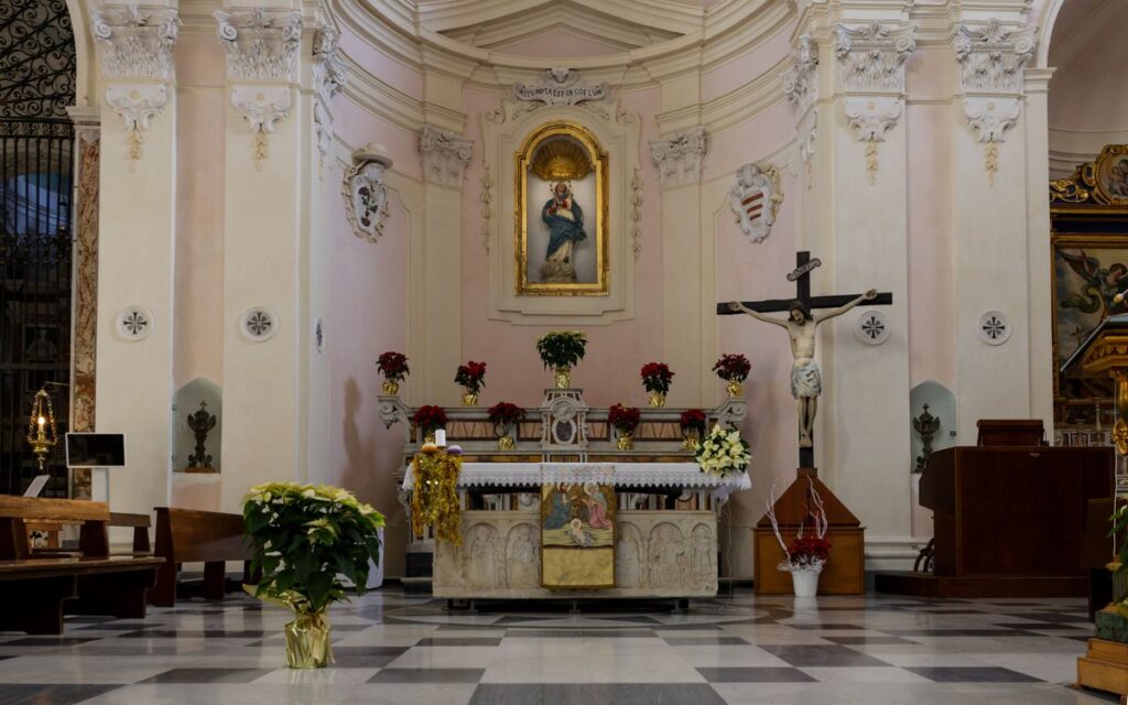 A beautiful, ornate church altar with religious art and decorations.